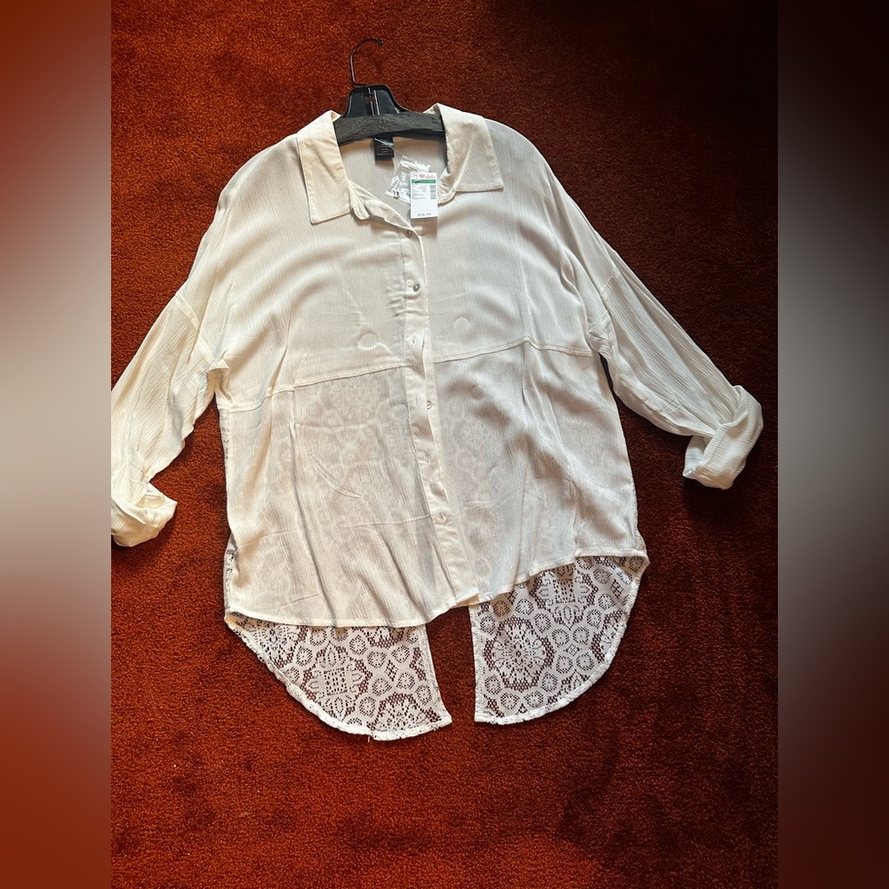 White button down shirt with lace split open back
Brand is Deb
Size L.